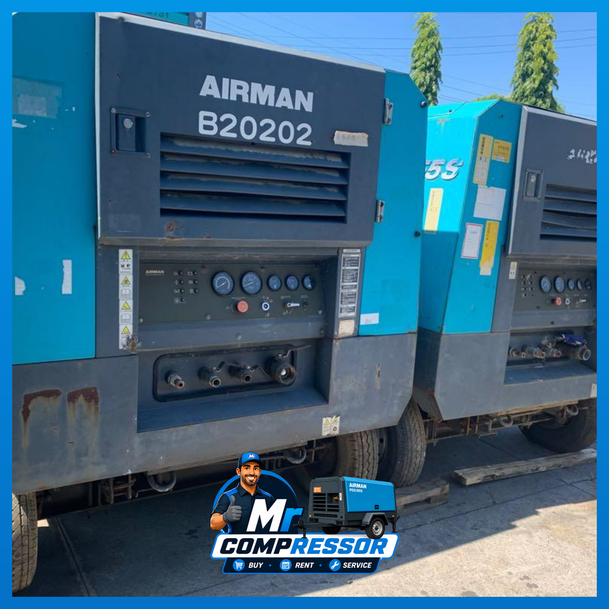 Airman diesel compressor powering pneumatic tools on a job site